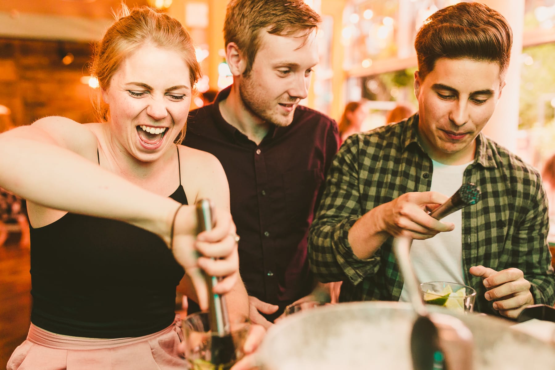 Commercial lifestyle photography for Bournemouth restaurant showing customers enjoying craft cocktails and social dining experience