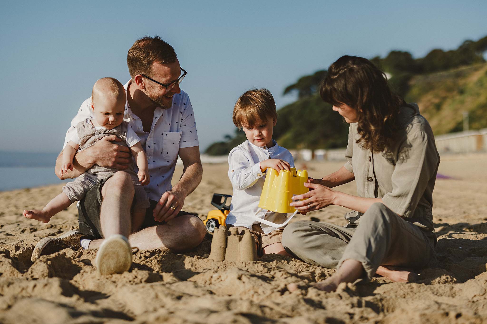 Outdoor family portrait on the beach near Poole, Dorset, documentary family photography