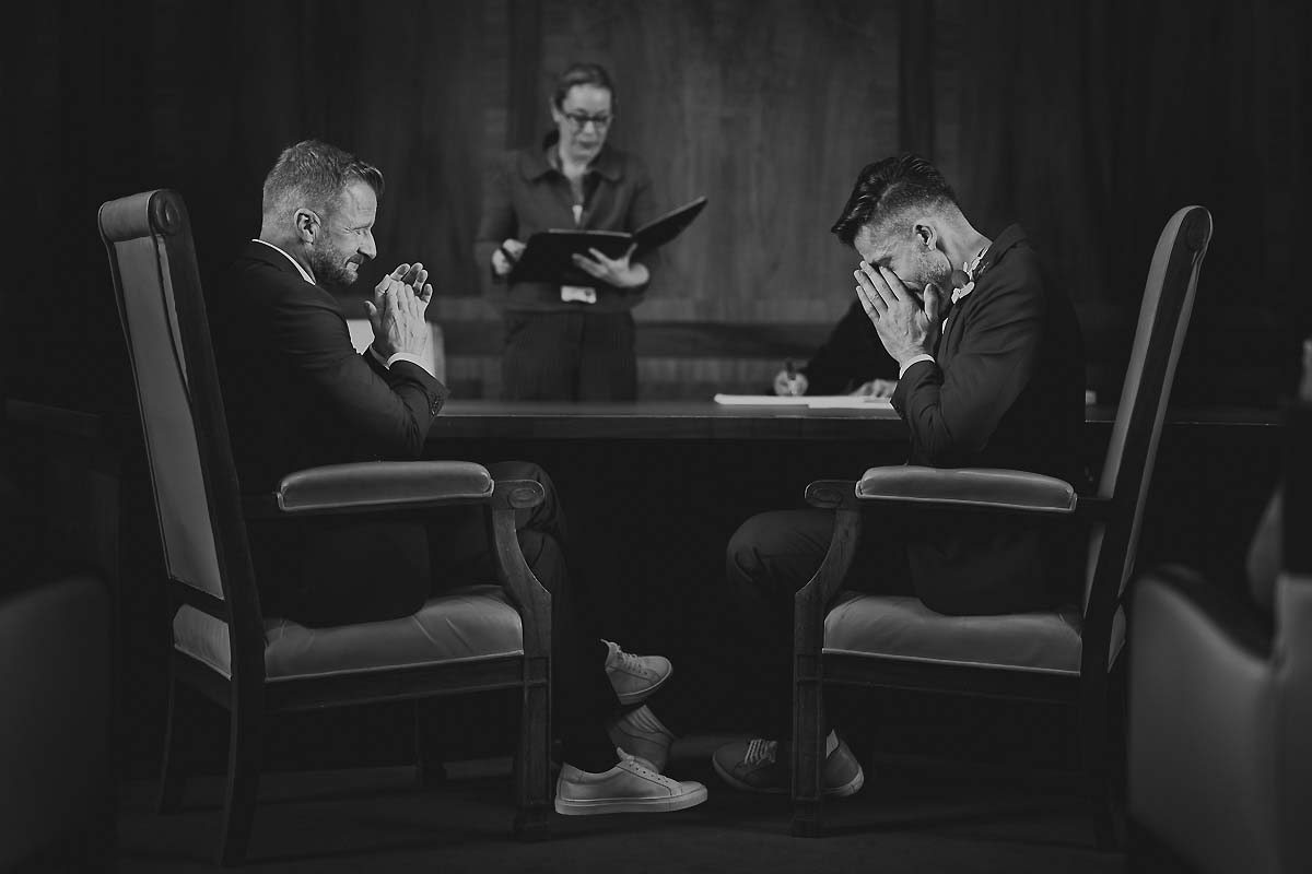 Emotional moment during ceremony by gay London wedding photographer
