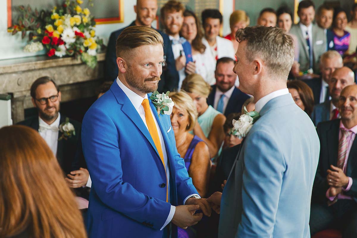Grooms exchange vows gay wedding photography