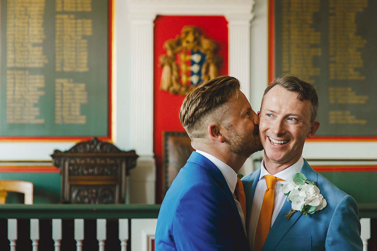 Grooms kiss gay wedding