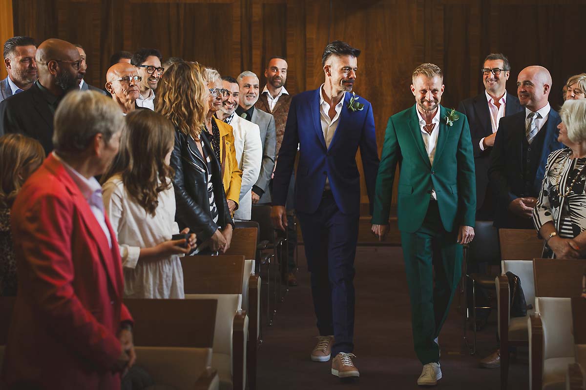 Grooms walk up the aisle - gay wedding photography in London