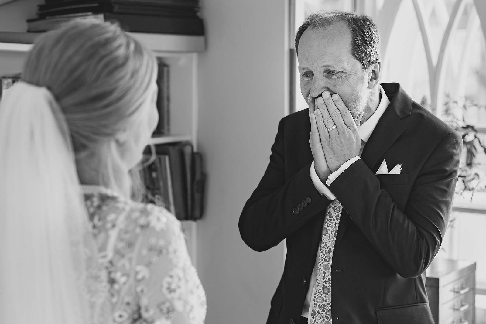 Tears and pride in a father’s eyes during the first look with his daughter