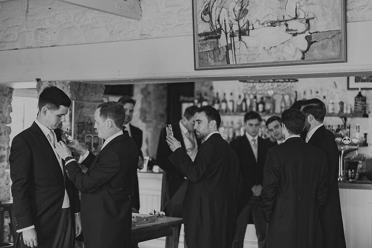 Groom and ushers at The Scott Arms pub in Swanage, relaxed pre-wedding drinks and candid moments