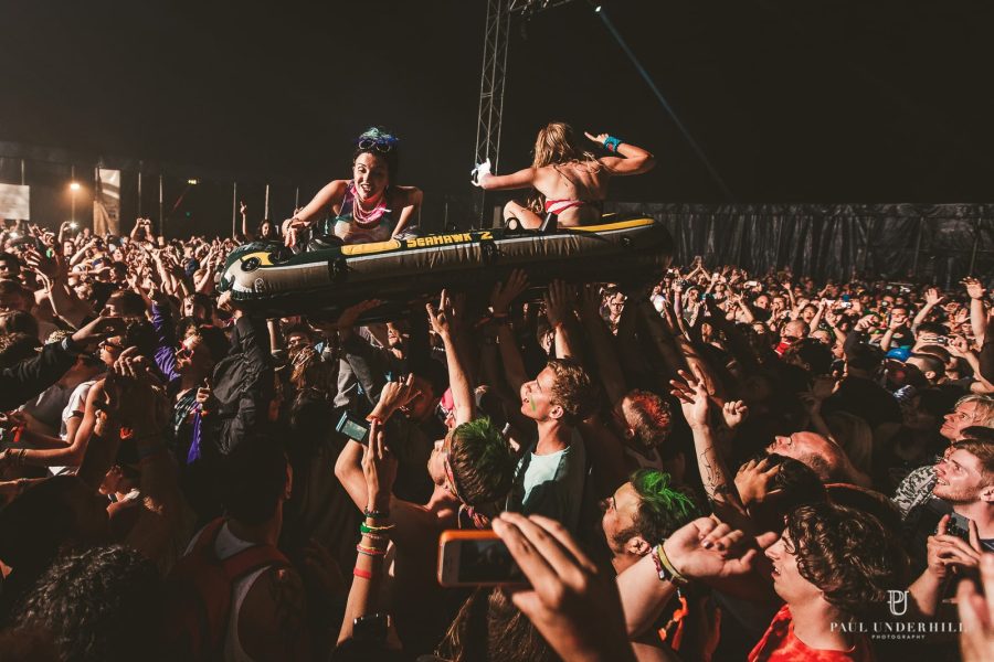 Crowd surfing at festival youth culture photography
