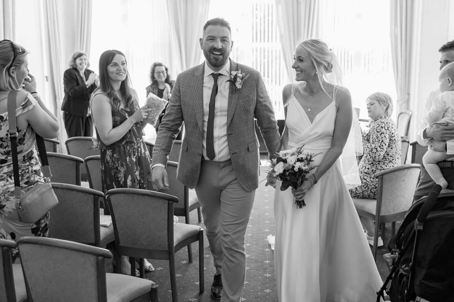 Bride and groom exit register office wedding in Dorset