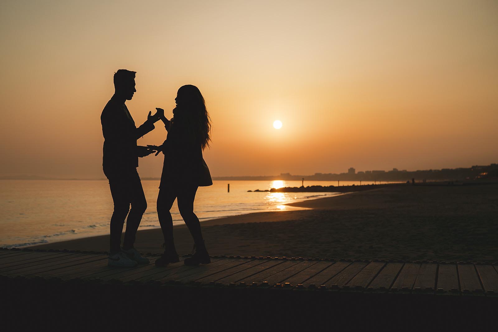 Relaxed pre-wedding shoot at sunset on the Dorset coast showing natural, documentary style photography