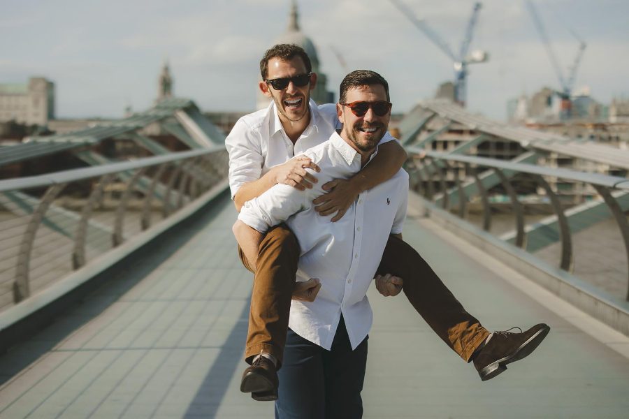 Fun pre wedding shoot with couple on city bridge