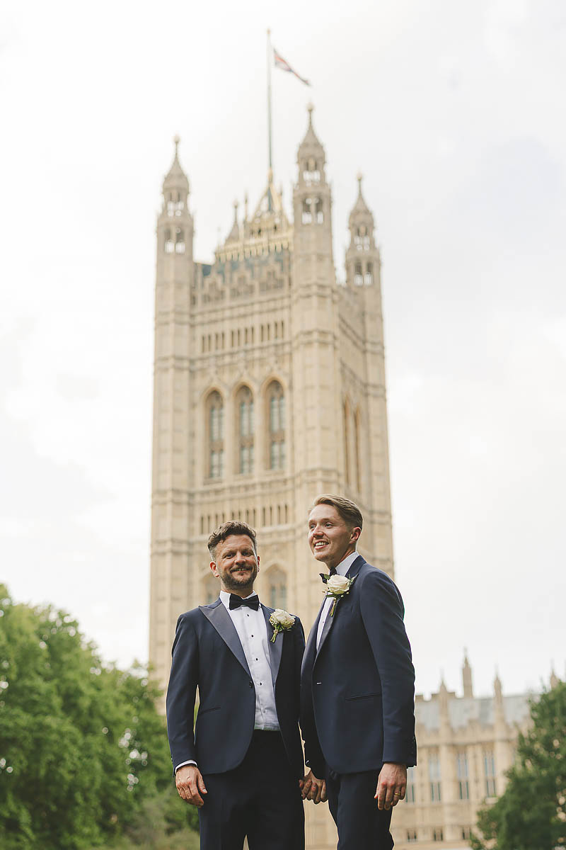 Same-sex wedding portrait of two grooms outside Westminster in London