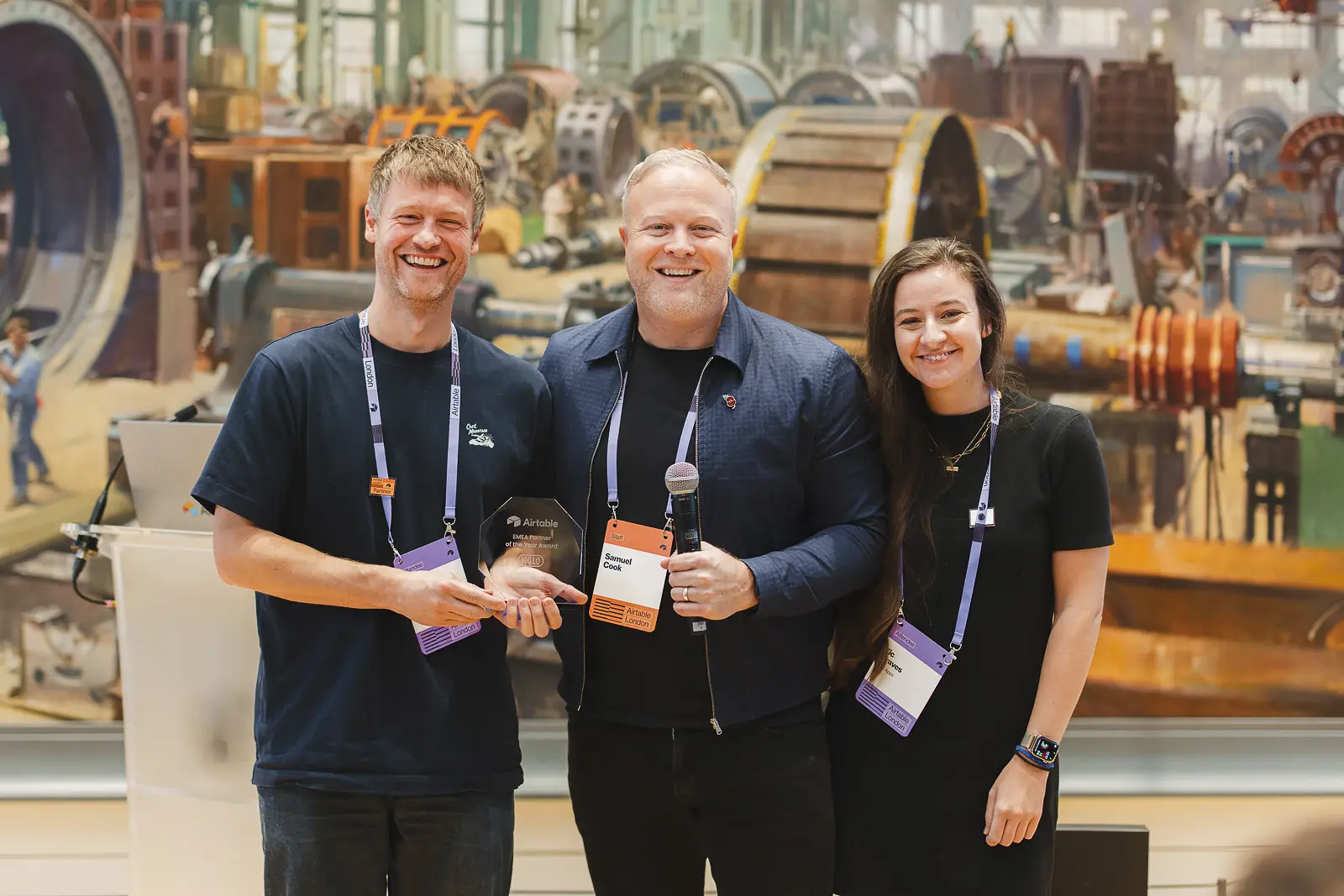 Award presentation during a conference event in London