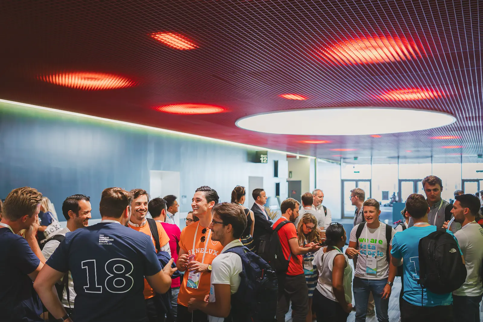 Conference delegates networking during a break between sessions at a business event