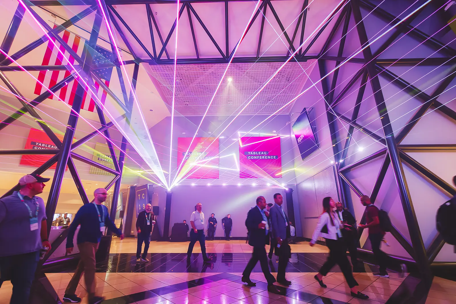 Conference production lighting and branded event environment during an evening programme