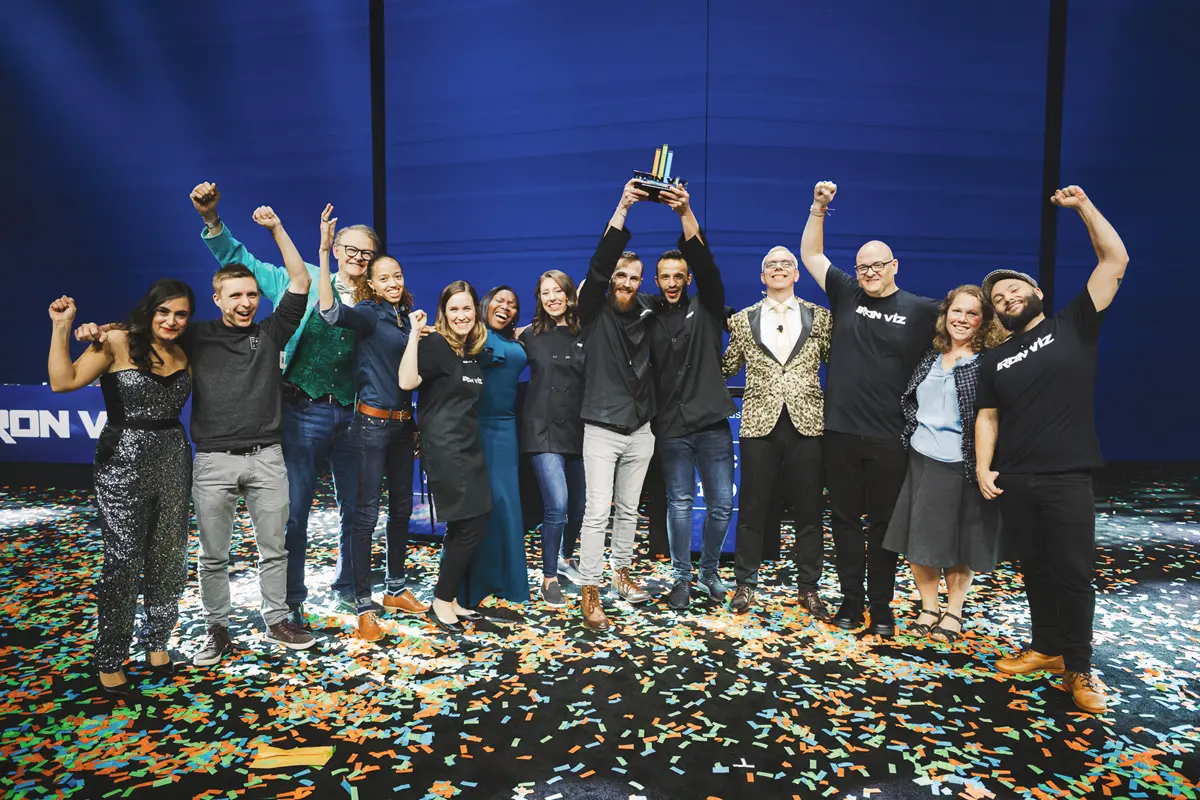 Team celebrating on stage during a corporate event awards moment