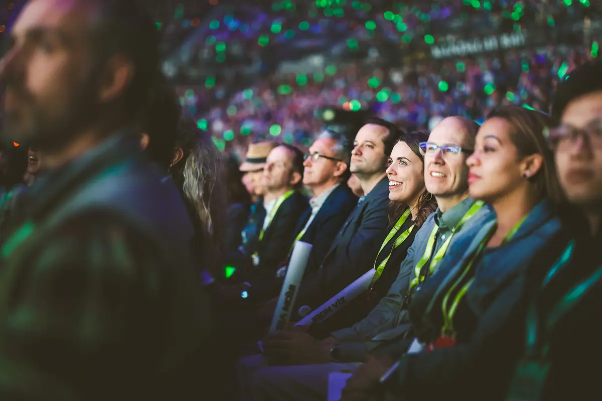 Audience watching keynote presentation at a corporate event