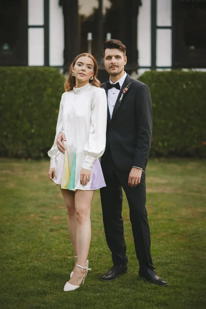 Bride in Oliver Rubin Dora reception dress with groom at Larmer Tree Gardens wedding