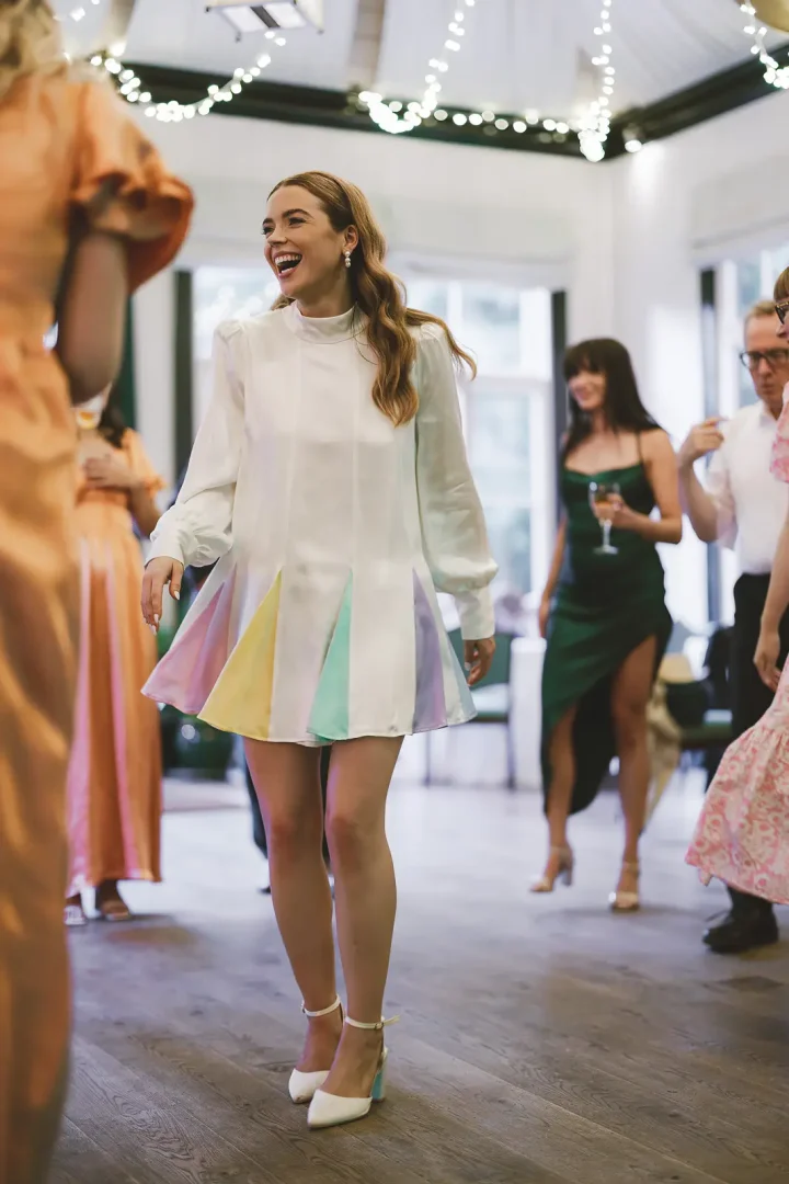 Bride dancing during evening reception in Oliver Rubin Dora dress at Larmer Tree Gardens
