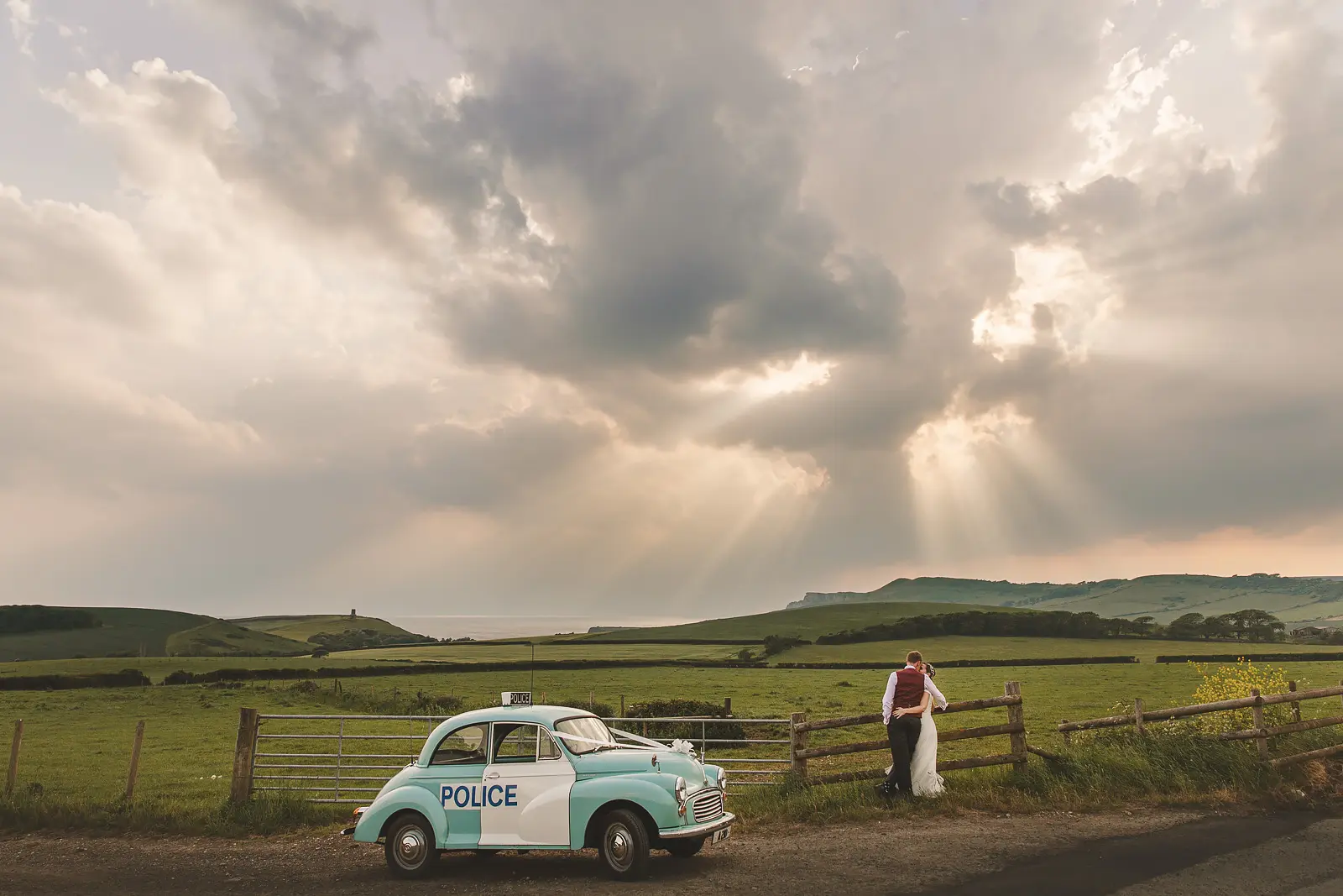 Smedmore House wedding couple overlooking Kimmeridge Bay and the Jurassic Coast at sunset