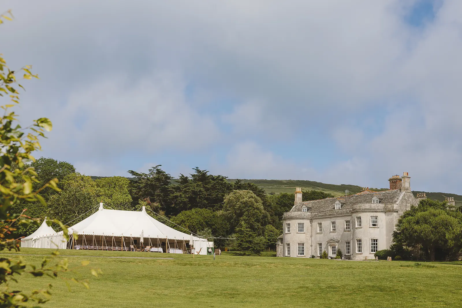 Wedding marquee on the lawn beside Smedmore House Dorset wedding venue