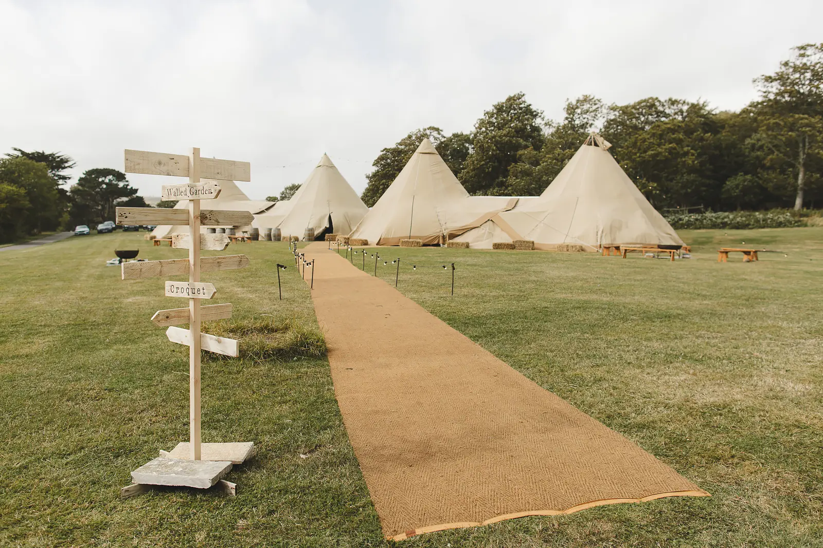 Wedding tipi marquee set on the lawn in front of Smedmore House in Dorset
