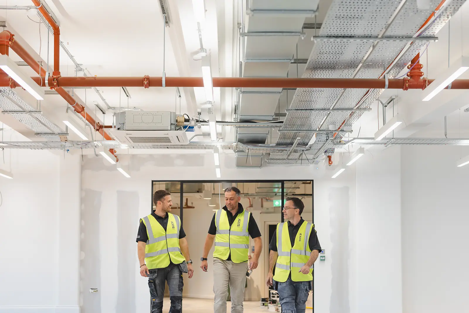 Lifestyle portrait of staff walking through office space at Bobbies in Bournemouth Town Centre