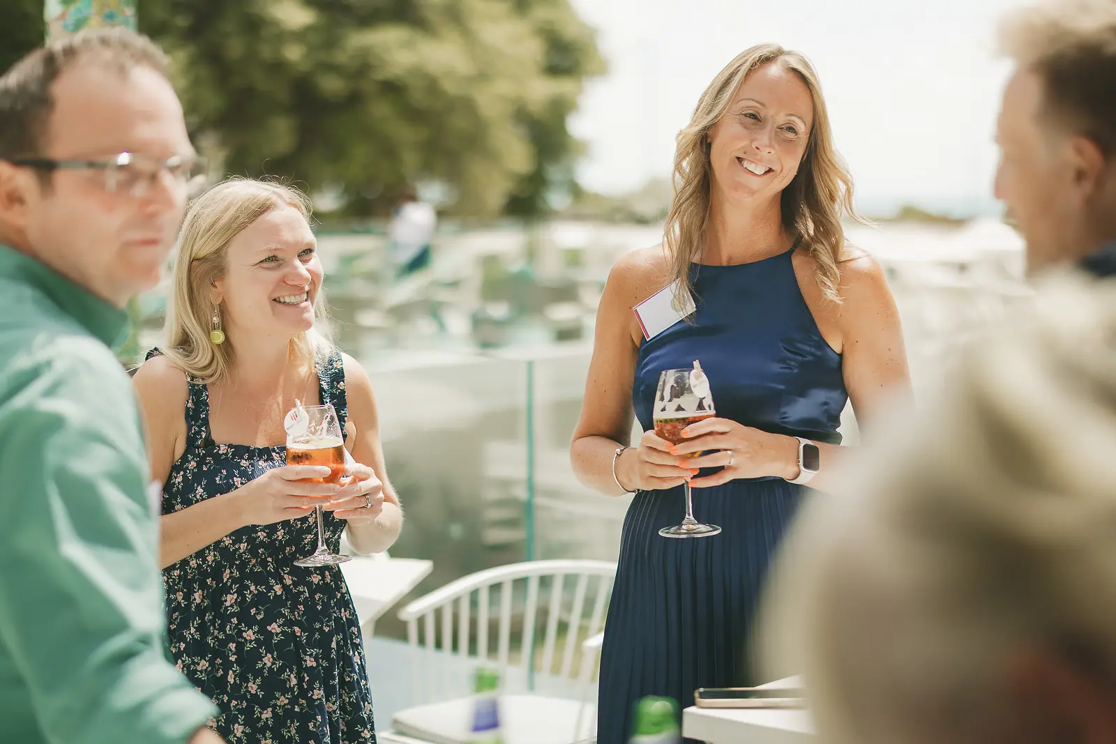 Guests networking with drinks during a summer corporate client event at The Nici hotel in Bournemouth