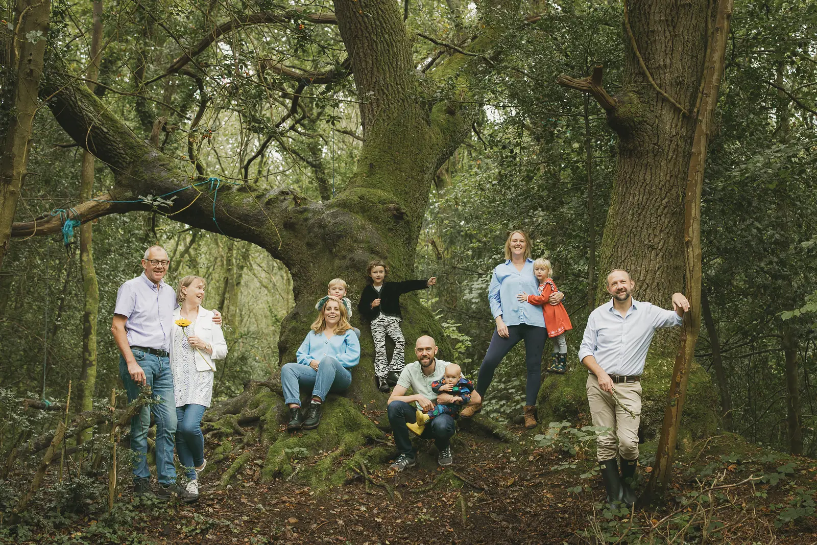 Extended family photographed during a relaxed woodland family shoot in Dorset.