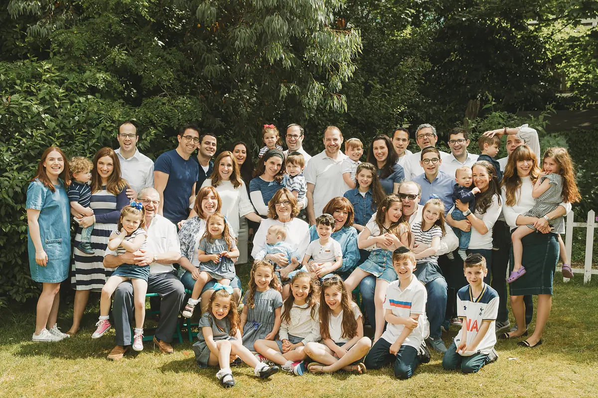 Large extended Jewish family photographed outdoors during a relaxed family shoot in Bournemouth.