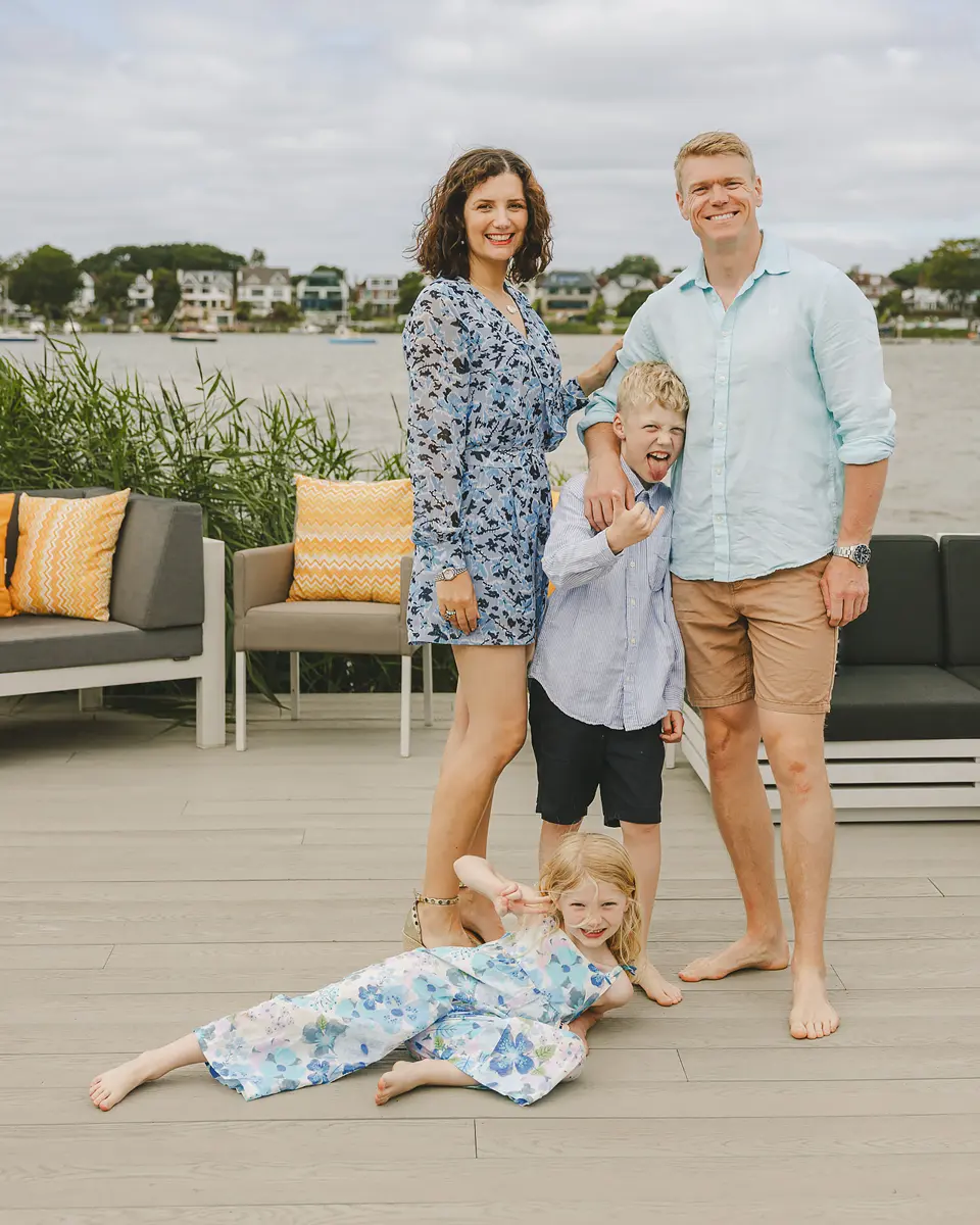 Relaxed family portrait photographed by the water in Poole, Dorset.