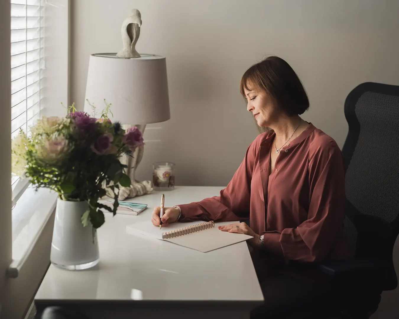Writer working from a home office during a personal branding photography shoot in Dorset.