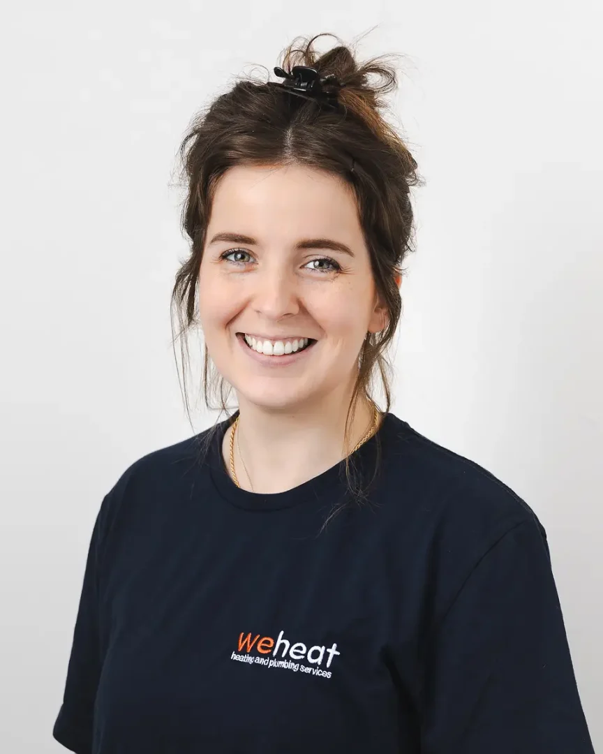 Branding photography headshot in Bournemouth of a smiling team member from a heating and plumbing services business.