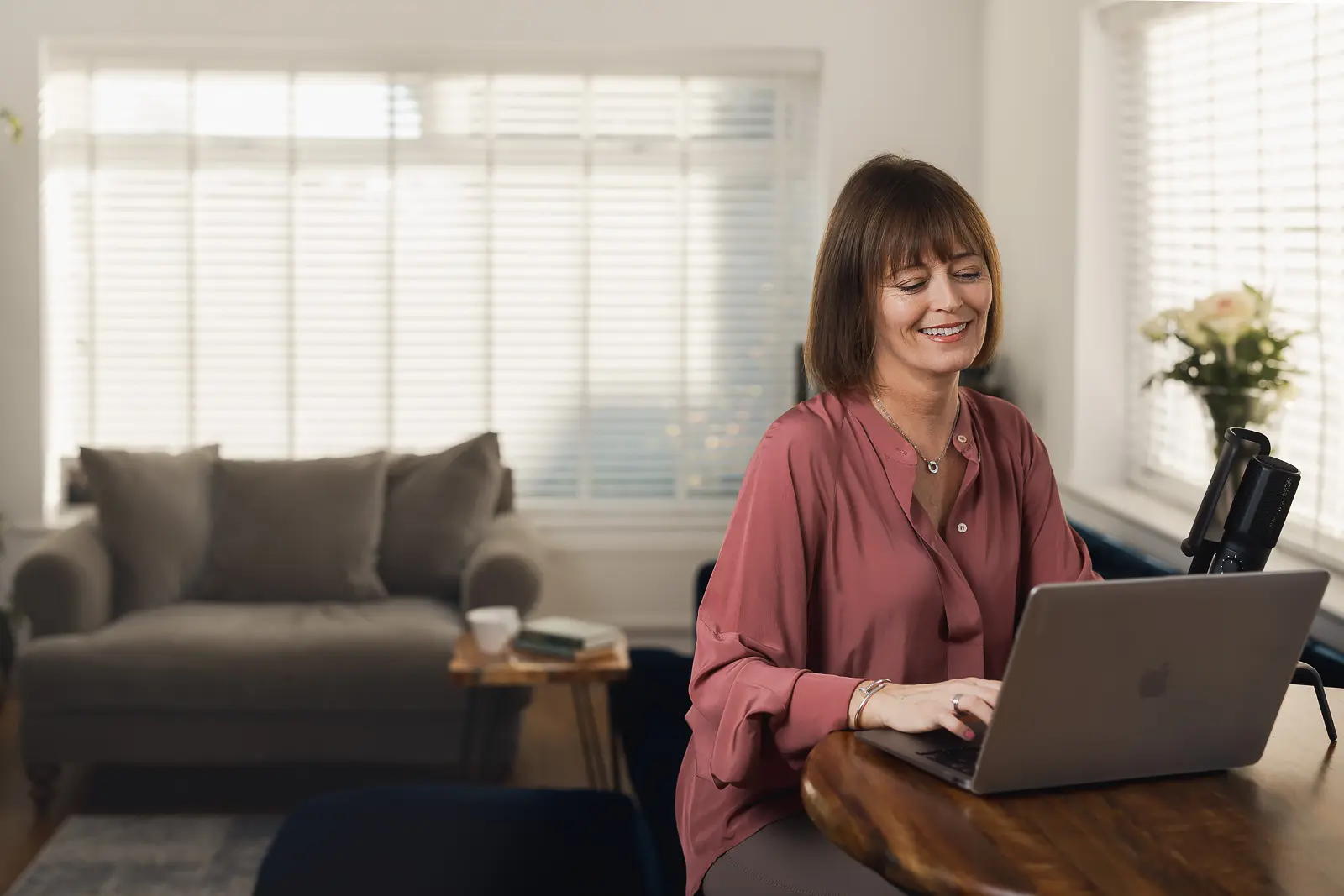 Writer and podcast host working from a home office during a personal branding photography shoot in Dorset.