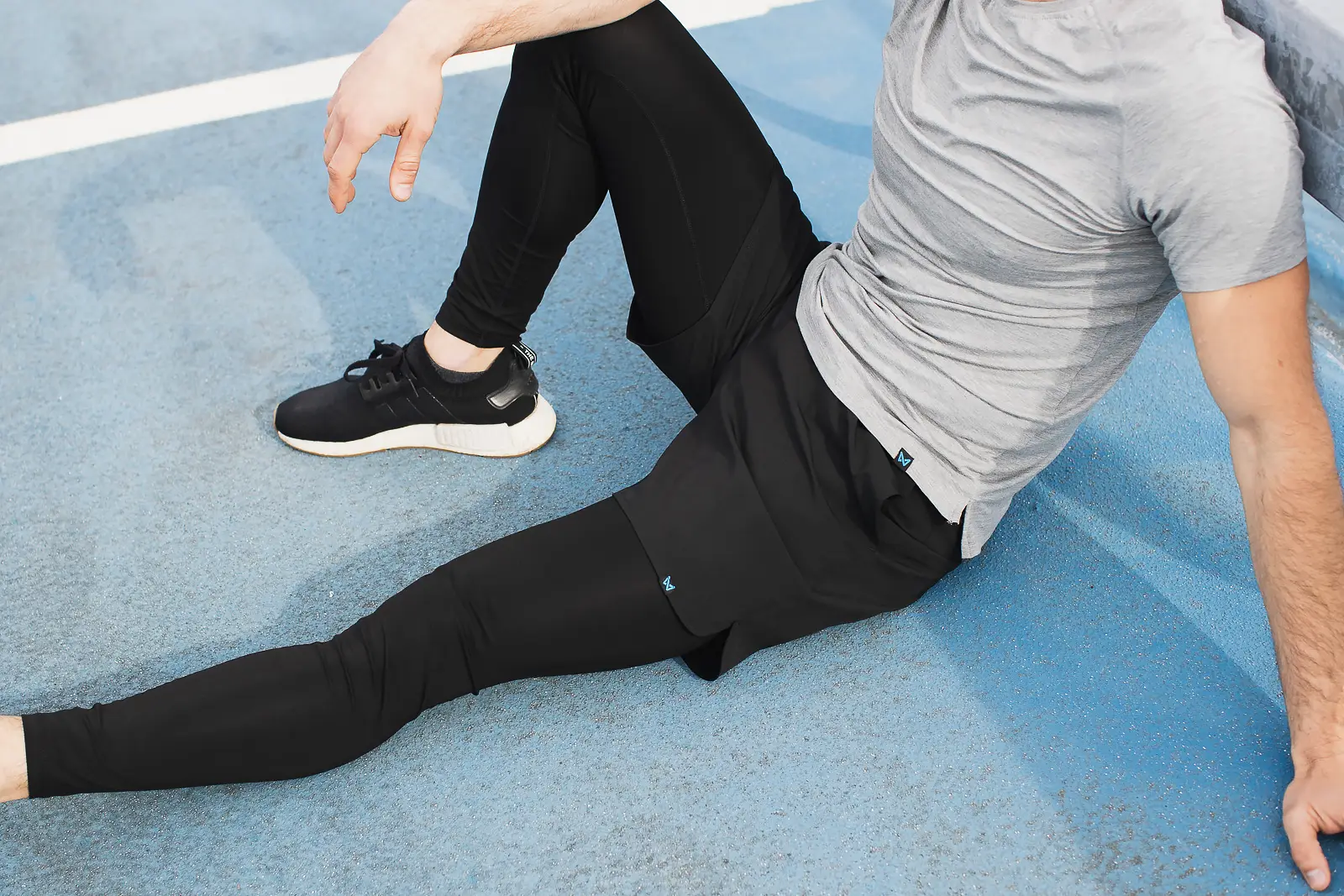 Close-up of activewear leggings detail on a running track in Bournemouth, from a commercial photography shoot